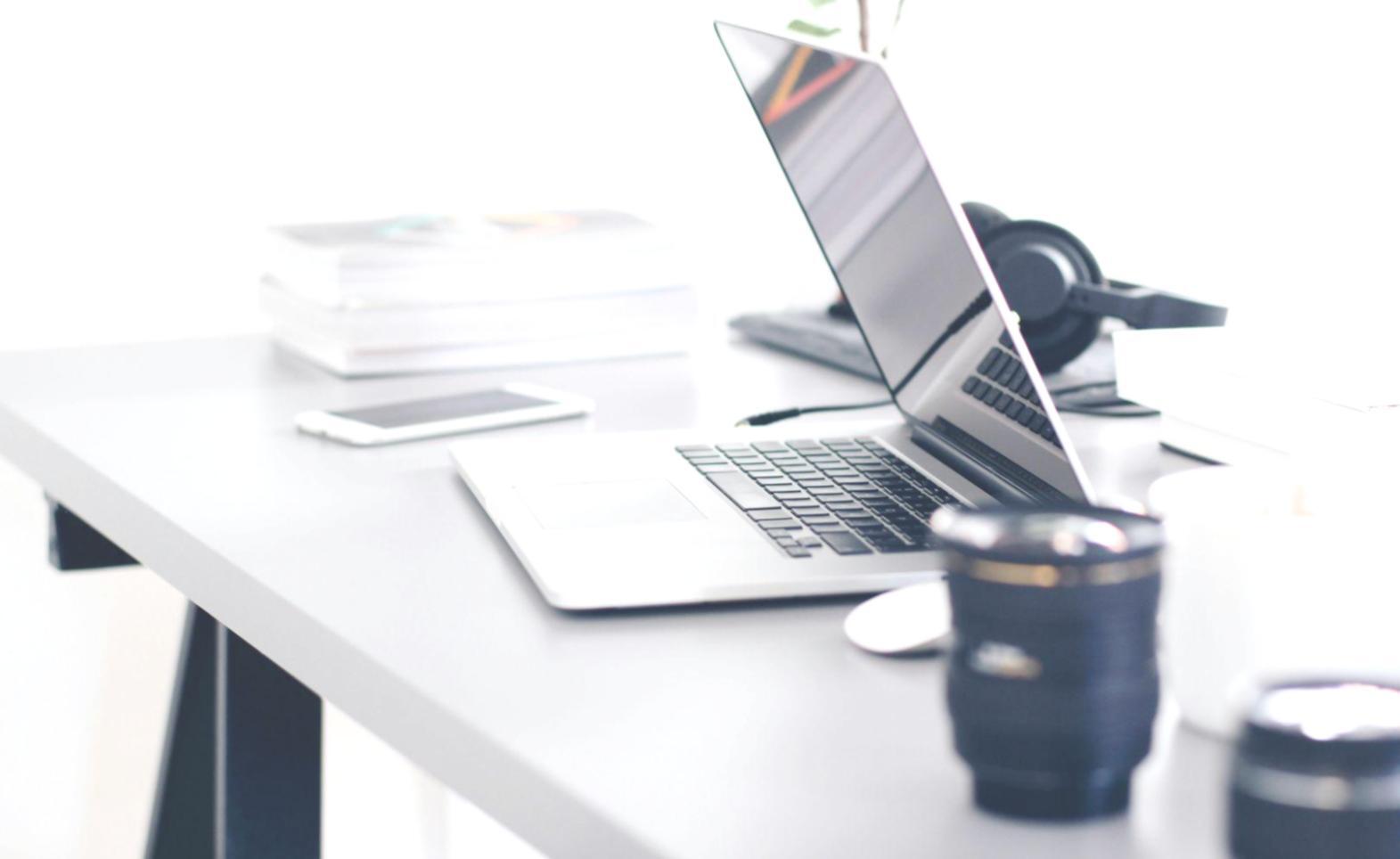 Professional event budget planning workspace with financial documents and planning materials